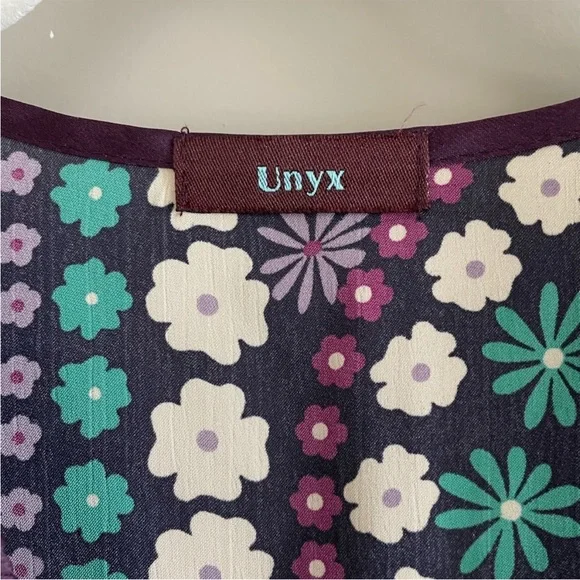 Unyx purple flower tunic. It is a bit sheer, you can see in the 4th picture - Picture 2 of 6